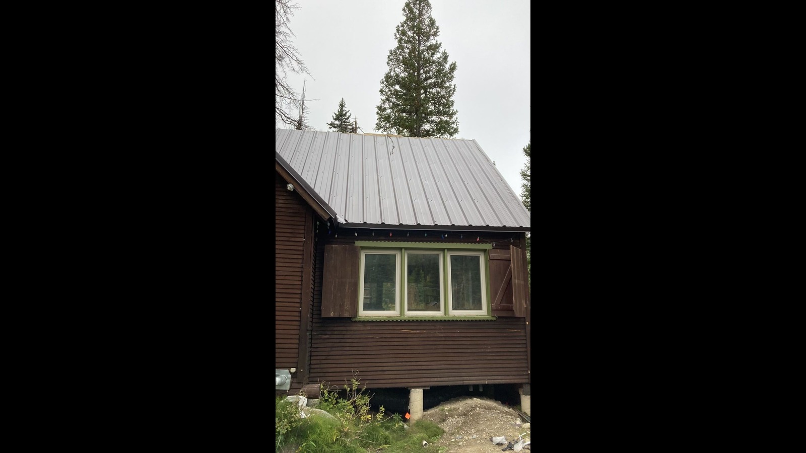 “How we Installed a New Metal Roof on a Cozy Cabin in Brighton”