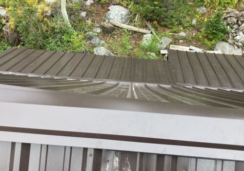 “How we Installed a New Metal Roof on a Cozy Cabin in Brighton”