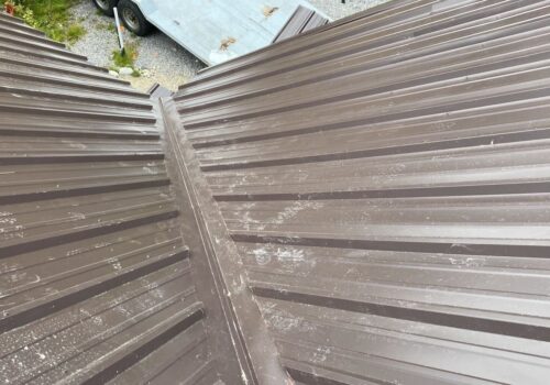 “How we Installed a New Metal Roof on a Cozy Cabin in Brighton”