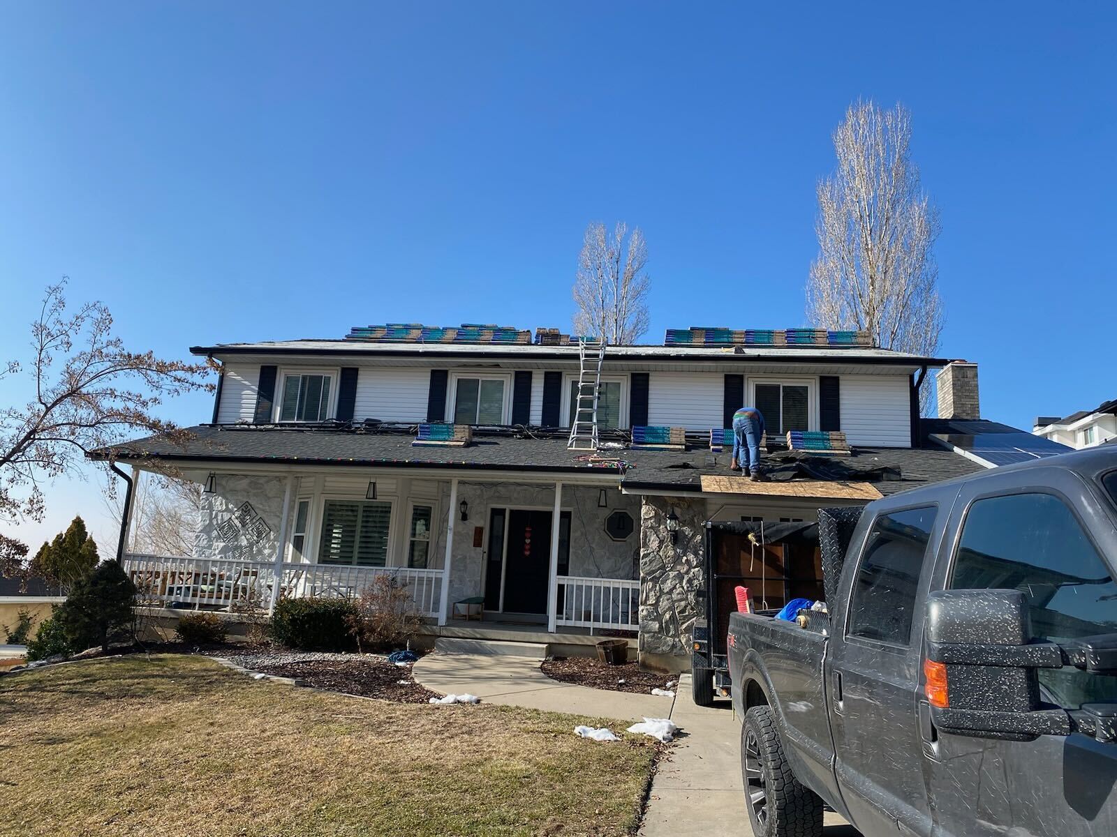 Transforming Centerville: New Porch Roof with Moire Black Shingles